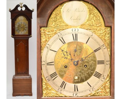 A late 18th century and later oak longcase clock with broken swan neck pediment above arched brass dial inscribed "JNO Rhodes