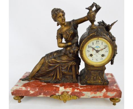An early to mid 20th century French gilt spelter eight day figural mantel clock with circular dial set with Arabic numerals a
