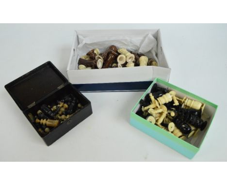 An early 20th century carved and stained bone chess set, an early 20th century carved and stained horn chess set in Japanese 