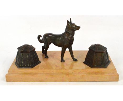 A French Art Deco style inkstand, the marble rectangular base set with a dished pen rest and twin inkwells (lacking liners), 