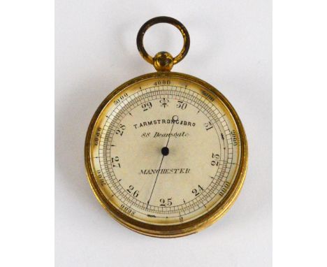 T ARMSTRONG & BROTHER OF MANCHESTER; a late 19th/early 20th century gilt metal cased pocket barometer, the enamel dial inscri