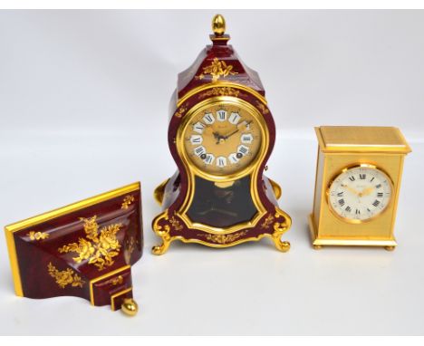 A Zenith decorative reproduction French style bracket clock with glass panels to front and sides, gilt floral decoration on m