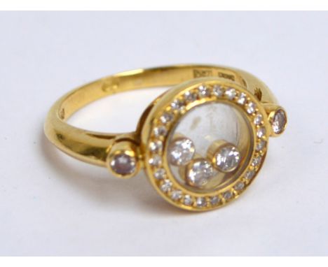 CHOPARD; an 18ct yellow gold "Happy Diamond" ring, size K, approx 5g. CONDITION REPORT: Appears good with no obvious signs of