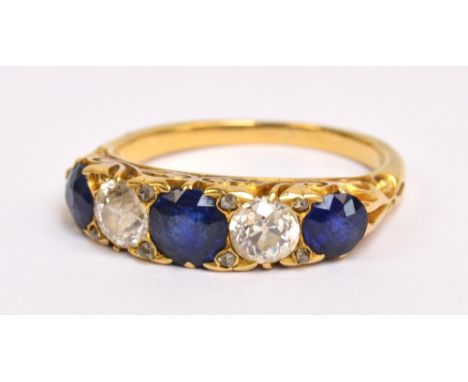 A Victorian yellow metal five stone dress ring, the three graduated sapphires alternating with two diamonds of approx 0.3cts 