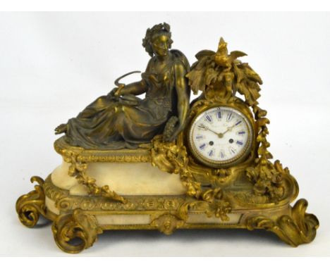 A 19th century French gilt metal and alabaster figural mantel clock, the drum type eight day movement with white enamel dial 