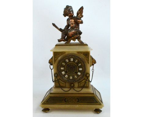A late 19th century French alabaster gilt metal mounted and spelter mantel clock, with cherubic finial above circular dial se