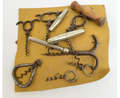 A small collection of hand-pull corkscrews, two travelling corkscrews with screw barrel handles and a Peter Dawson's Scotch W