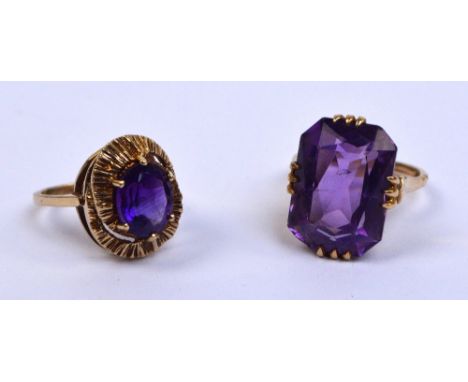 Two 9ct yellow gold dress rings set with amethyst coloured stones, size O and M, combined approx 11.7g (2). CONDITION REPORT: