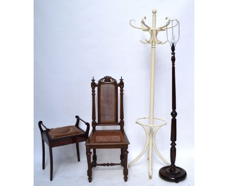 A late Victorian oak cane backed and cane seated hall chair, an Edwardian box seat piano stool, a hall stand and a fluted sta