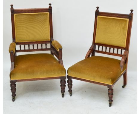 A pair of Victorian walnut and upholstered lady's and gentleman's chairs with spindle decoration, on turned ring front legs a