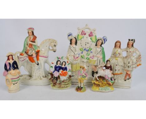 Five 19th century Staffordshire figure groups to include lovers in a garden, a man playing pipes upon a horse, a woman upon a