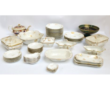 A large quantity of Limoges dinner ware decorated with gilt sprigs of flowers and leaves comprising ten dinner plates, twelve