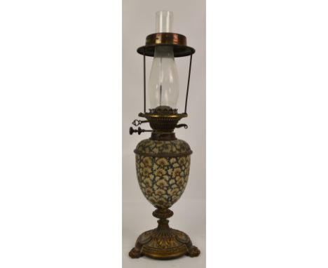 A late 19th century Messenger's Patent oil lamp, the ovoid stoneware body in the style of Royal Doulton, with gilt metal base