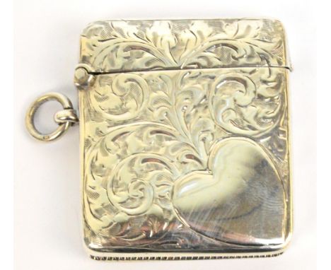 A George VI hallmarked silver vesta case of rectangular form with heart shaped cartouche to the corner of one side on foliate