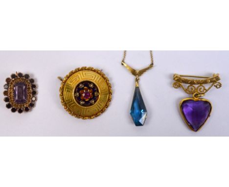 A Victorian circular yellow metal target brooch with blue enamel decorated gem set floral central spray, an amethyst coloured