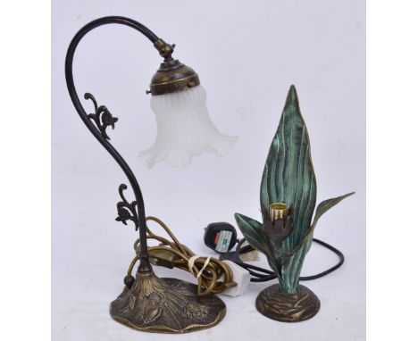 A decorative metal table lamp with floral base, curved stem and opaque glass shade, height 41cm, and a further decorative lam