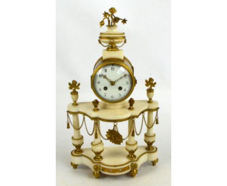 A 19th century French gilt metal and alabaster eight day mantel clock, the floral decorated urn finial above drum type eight 