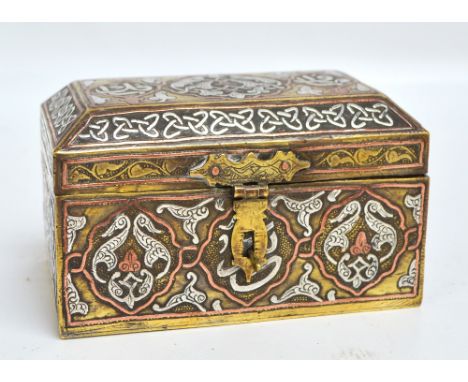 A late 19th century Cairo Ware brass trinket box of rectangular form, silver and copper inlaid with ornamental motifs to each