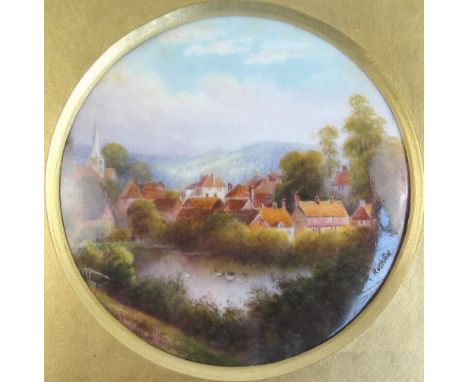 A Royal Worcester porcelain circular plaque hand painted with a lake townscape with ducks, signed R Rushton lower right (Raym
