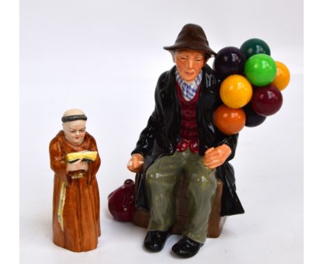 A Royal Doulton figure; HN1954 "The Balloon Man" and a Royal Worcester porcelain candles snuffer modelled as a reading monk, 