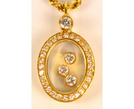 CHOPARD; an 18ct yellow gold "Happy Diamonds" oval pendant on 18ct yellow gold Chopard chain, length of chain 40cm, approx 12