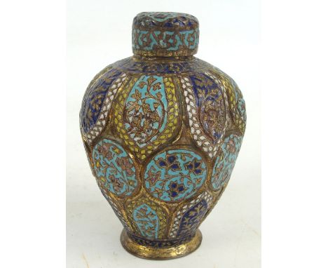 An Eastern brass and enamel floral decorated tea caddy of baluster form with incised body with similarly decorated cover, hei