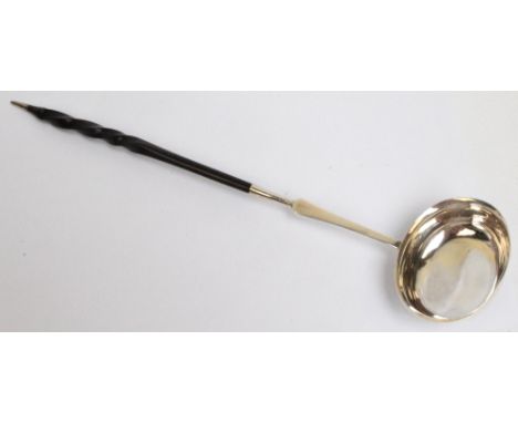An early to mid 19th century Scottish provincial silver toddy ladle with plain oval bowl with flared rim and flat tapering st