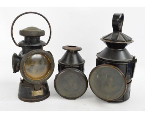 A vintage railway lamp bearing plaque inscribed "AMP Manufacturing & Railway Supplies Ltd, Dorking", height 32cm, a similar s
