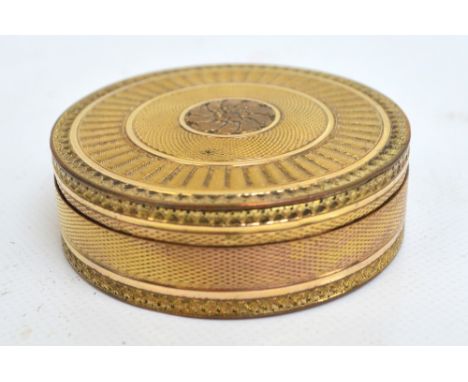 A 19th century French gilt metal box with overall engine turned decoration centred with a floral roundel to the base and to t