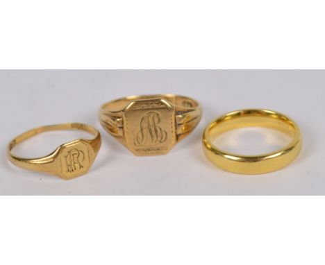 An 18ct yellow gold wedding band, size K/L, approx 5.5g, and two 9ct gold signet rings, combined approx 4.5g (3).
