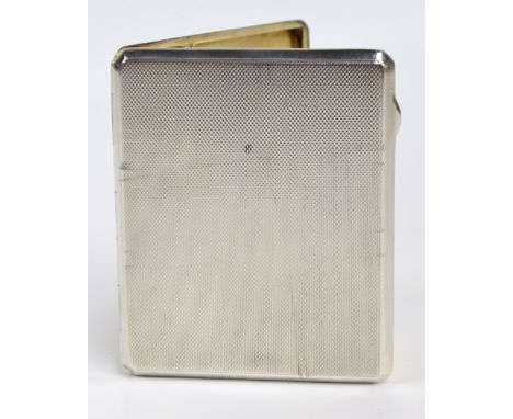 A George VI hallmarked silver cigarette case of rectangular form with overall engine turned decoration, the gilt washed inter