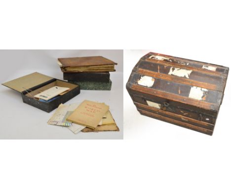 A trunk containing a quantity of ephemera, predominantly maps from the late 19th and early 20th century.