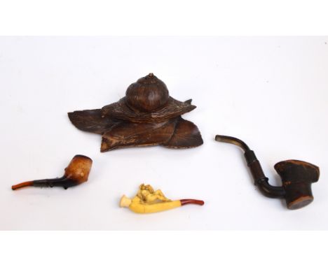 A late 19th/early 20th century Black Forest carved wooden inkwell modelled as a snail on leaves acting as a pen rest, width 1