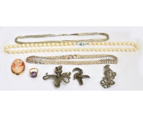 A group of costume jewellery comprising a 9ct yellow gold and amethyst ring, size L/M, a 9ct yellow gold mounted oval cameo b