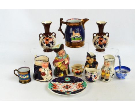 A quantity of mixed ceramics including a Gaudy Welsh plate and three jugs, a ladle, Toby jugs, a pair of vases etc.
