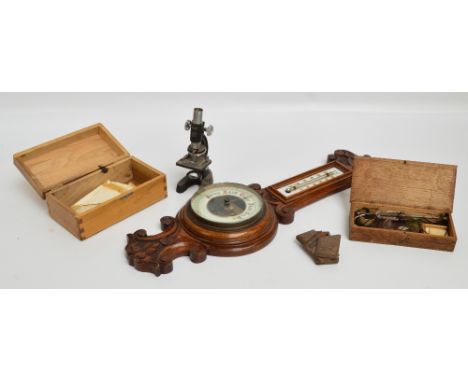 A boxed "Sky Bolt" field/student's microscope, a boxed set of balance scales with glass pans and a set of weights, a 1920s ca