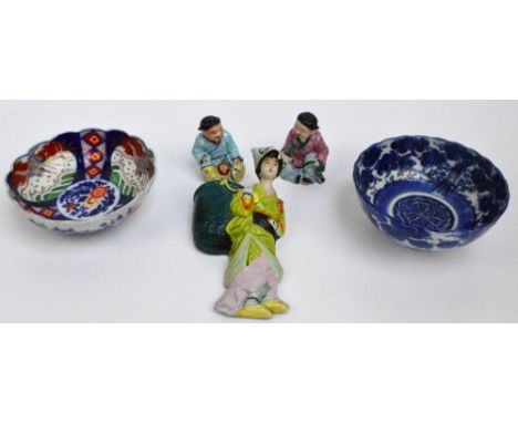 A pair of 20th century Chinese porcelain and enamel decorated figures of seated children, a similar wall pocket, also a Japan