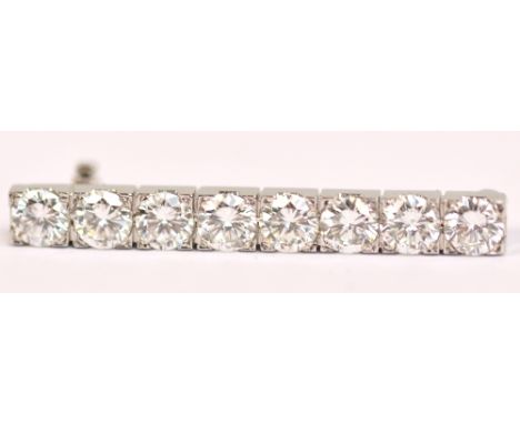 BOODLE & DUNTHORNE; an 18ct white gold and diamond bar brooch/tie pin, the rectangular platform set with eight brilliant cut 