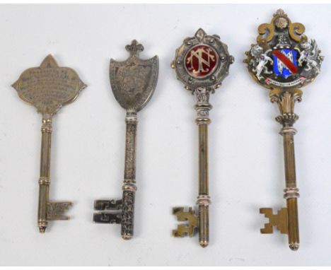 Four Victorian and later presentation keys awarded to Thomas Norton Esq.D.L. including a shield shaped group decorated exampl