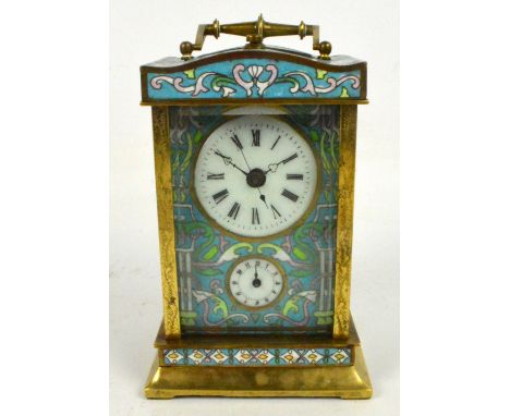 A decorative brass and enamel decorated carriage clock with swing loop handle above white enamelled dial set with Roman numer