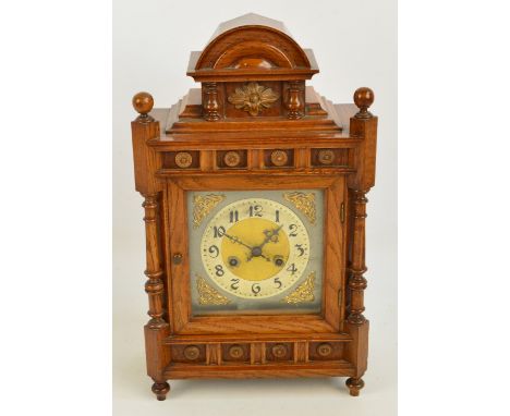 A late 19th century oak mantel clock.