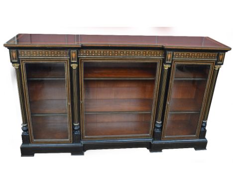 A good late 19th century Aesthetic Movement ebonised, amboyna crossbanded and inlaid  credenza of inverted breakfront form, t