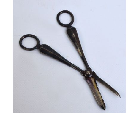 A pair of George V hallmarked silver grape scissors of plain design with simple ring handles, Atkin Bros, Sheffield 1933, app