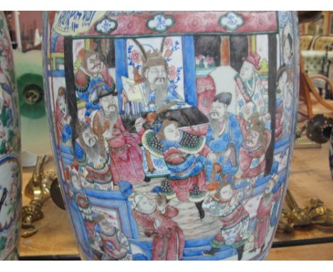 A pair of large 19th century Chinese Canton vases of baluster form, each painted in enamels with two opposing rectangular pan