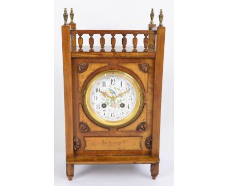A late 19th century walnut and mahogany aesthetic movement mantel clock with three quarter galleried top above painted enamel