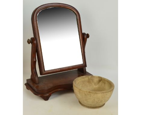 A late 19th century freestanding mahogany dressing table mirror with curbed top, with swing arrangement, shaped front  to bas