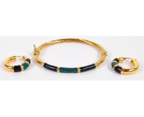 An Italian 14ct yellow gold snap bangle of wrythen form set with three blue enamel sections and a pair of matching earrings, 
