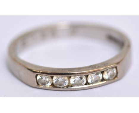 An 18ct white gold and five stone channel set diamond ring, size L, approx 3.1g.