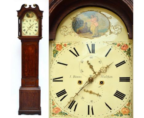 An early 19th century oak eight day longcase clock, the hood with broken swan neck pediment above repainted arched dial inscr