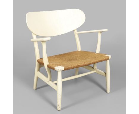 Designed by Hans Wegner for Carl Hansen &amp; Son, Model No CH-22, the white coloured wooden chair with a curved back, wide a